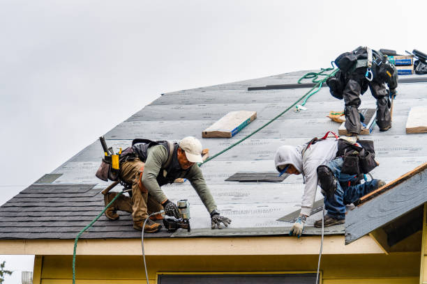 Professional Roofing technician working in Maspeth, NY